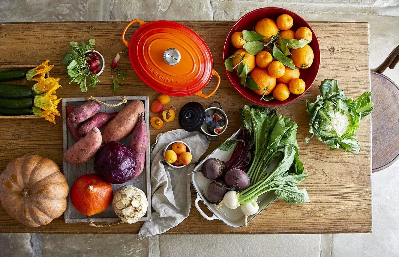 Le Creuset Farm Fresh collection including Oval Casserole in Volcanic and various autumnal vegetables