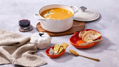 Le Creuset Round Casserole Volcanic, Satin Black with pumpkins and Halloween setting