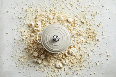 Le Creuset Meringue Round Casserole with meringue crumbs