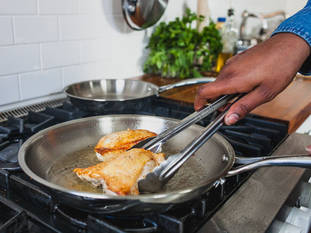 Cooking fish in stainless steel pan