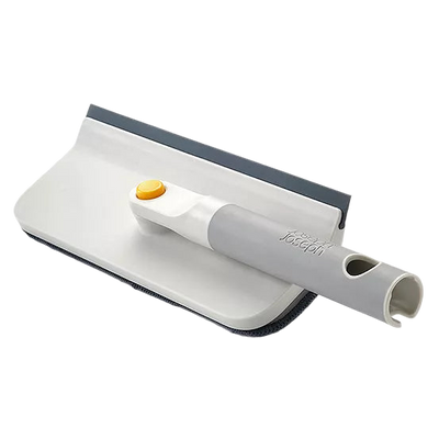 Cleaning tool with squeegee and brush on a white background