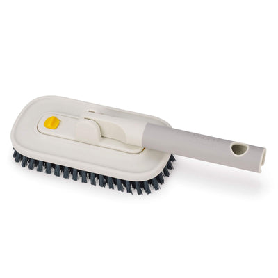 Cleaning brush with bristle head and handle on a white background
