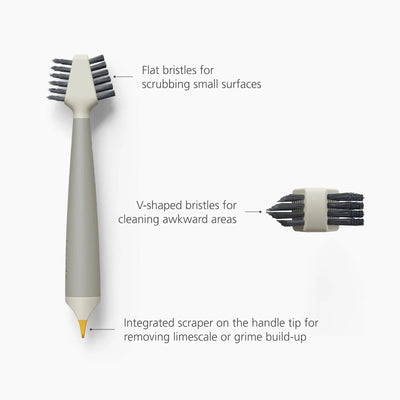 Cleaning brush with flat and V-shaped bristles on a white background