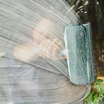 Person cleaning a window