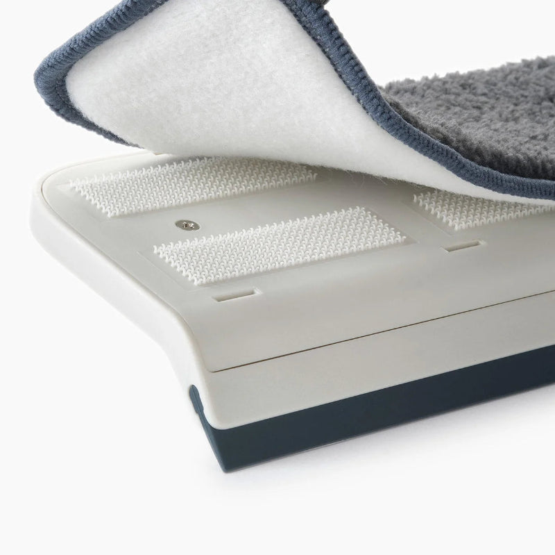 Gray and white pet mat with textured surface on a white background