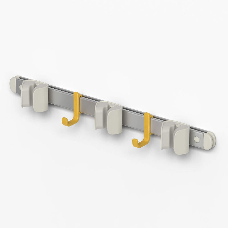 Metallic wall hook with yellow hooks on a white background