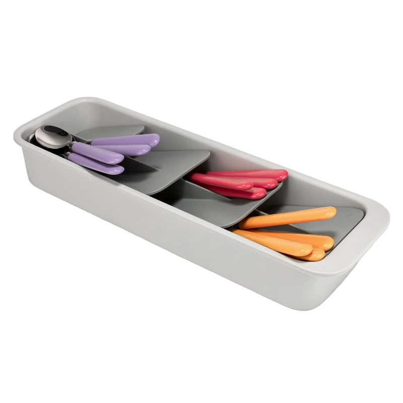 Gray tray with compartments containing colorful utensils on a white background