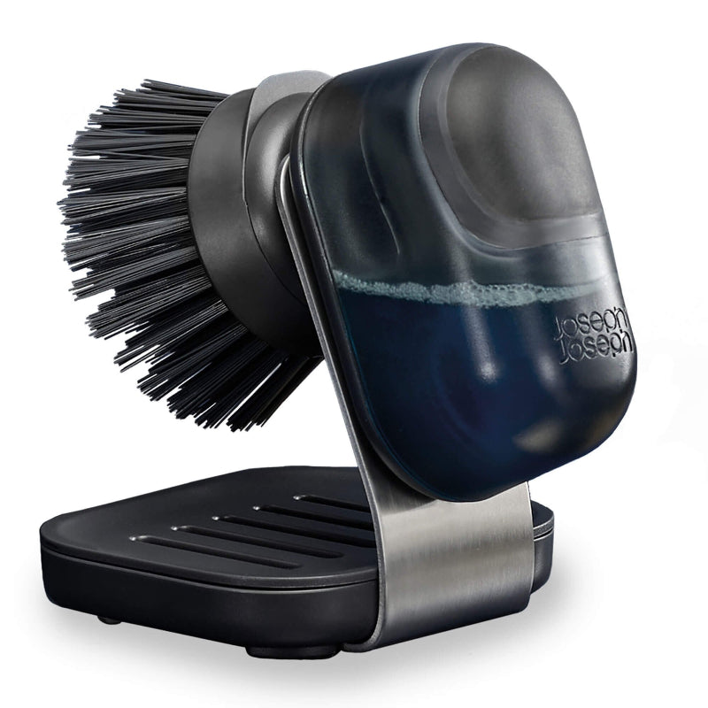 Black and silver dish brush with holder on a white background, featuring the Joseph Joseph brand.