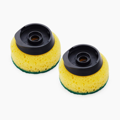 Two yellow sponges with black centers on a white background