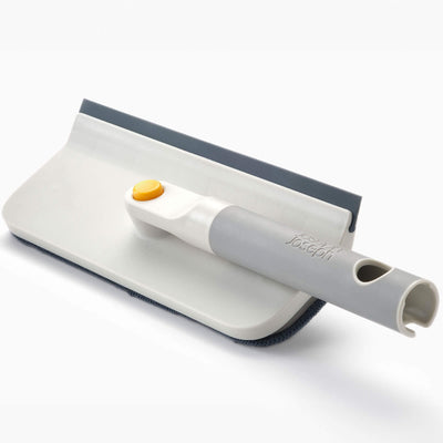 Cleaning tool with squeegee and scrubber on a white background