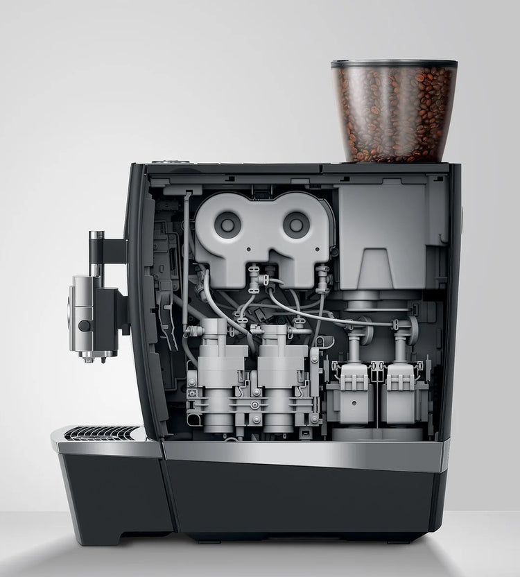 Bean-to-cup coffee machine cutaway showing integrated grinder