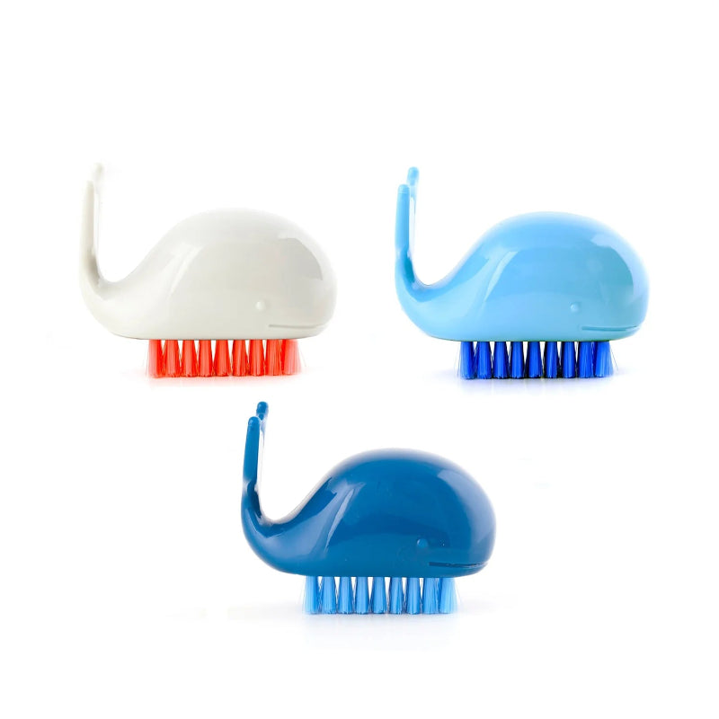 Three whale-shaped scrub brushes in different colors on a white background.