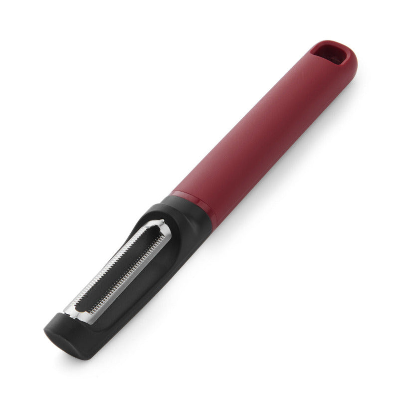 Red and black vegetable peeler on a white background