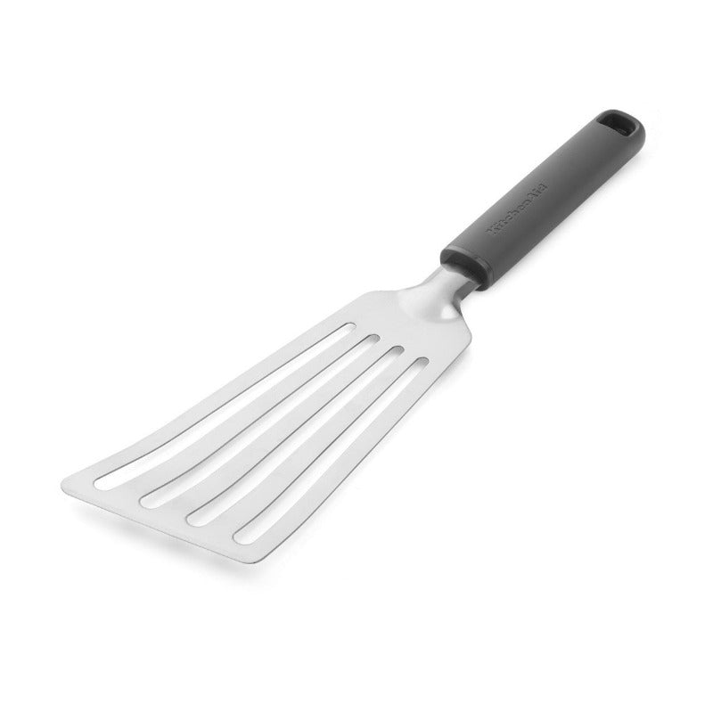 Metal spatula with black handle on a white background