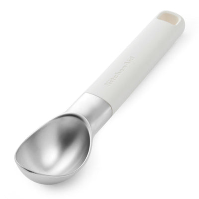Ice cream scoop with white handle on a white background