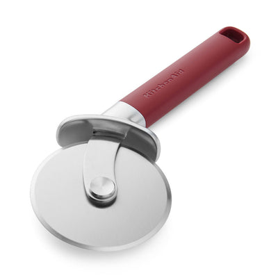 Red-handled pizza cutter on a white background