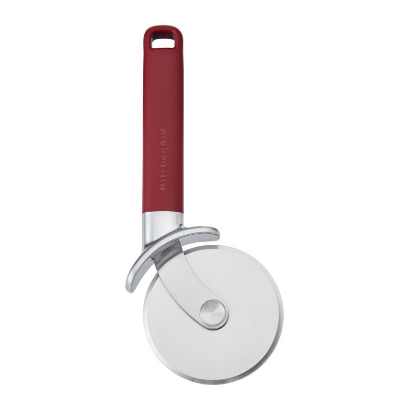 Red-handled pizza cutter on a white background
