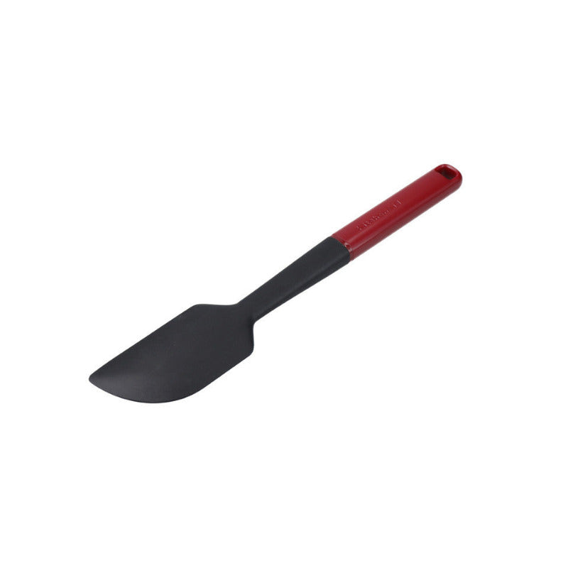 Black spatula with a red handle on a white background