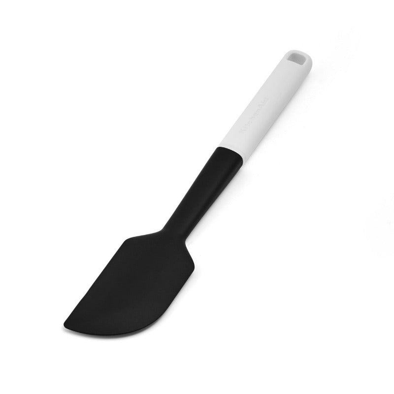 Black spatula with a white handle on a white background