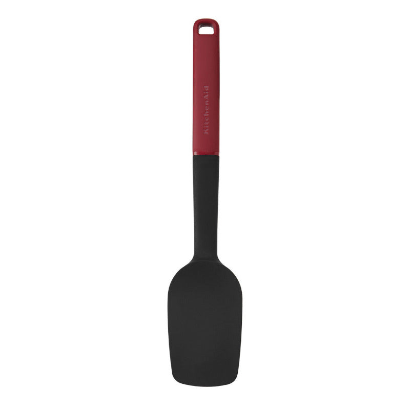 Black spatula with a red handle on a white background