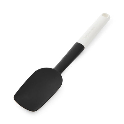 Black spatula with a white handle on a white background