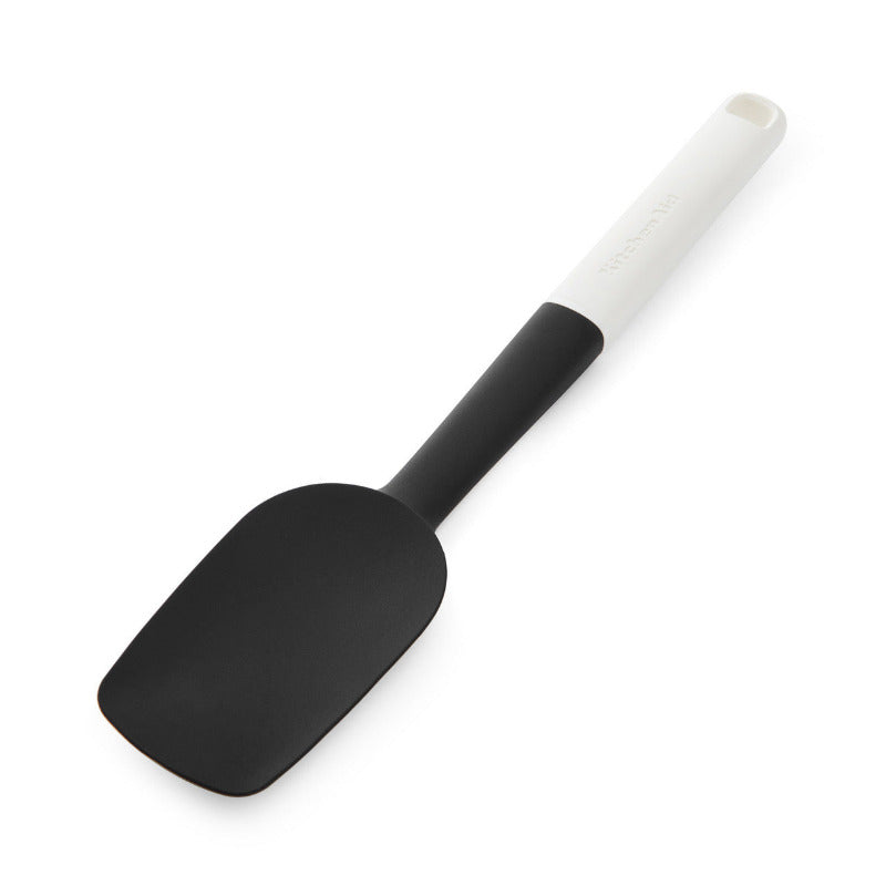 Black spatula with a white handle on a white background