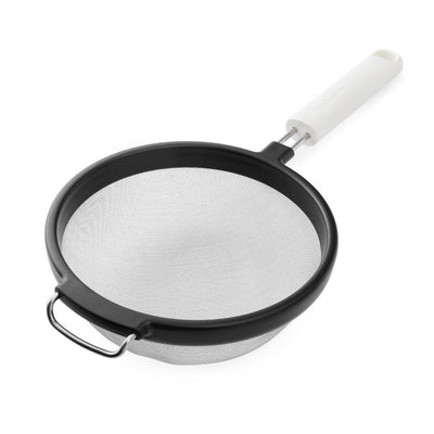 Black strainer with white handle on a white background