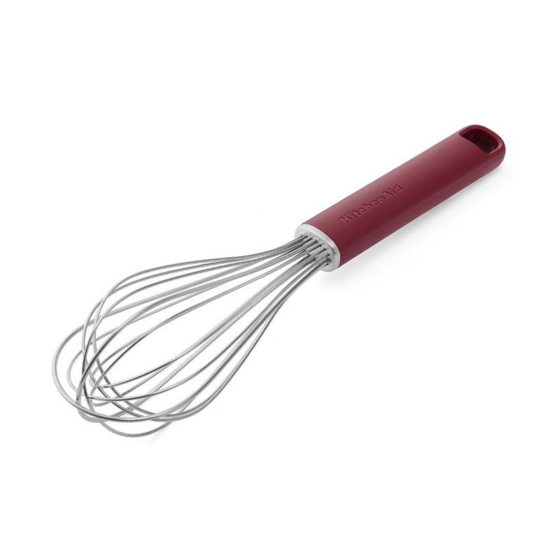 Red-handled whisk on a white background