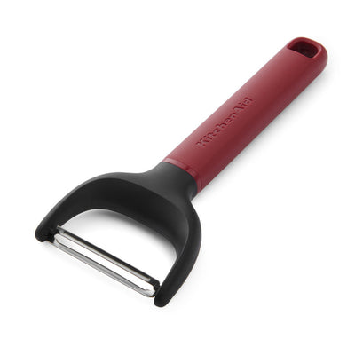 Red and black y-peeler on a white background