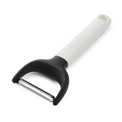 Y-shaped peeler with white handle and black rubberized grip on a white background