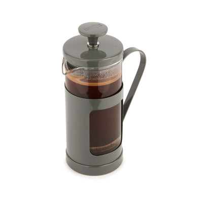 French press with coffee on a white background