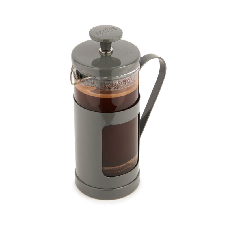 French press with coffee on a white background