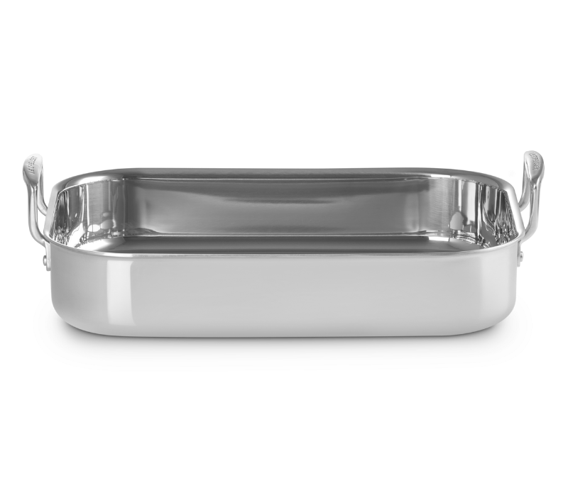 Silver rectangular tray with handles on a black background