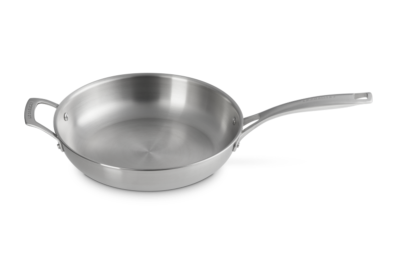 Stainless steel frying pan on a white background