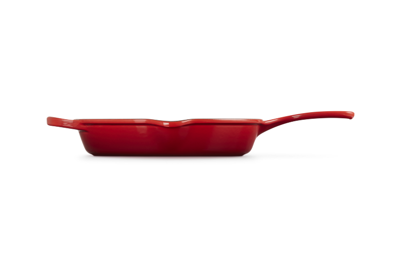 Red frying pan on a white background