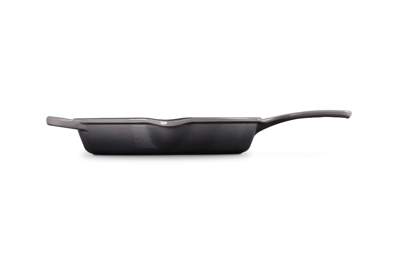 Black frying pan on a white background