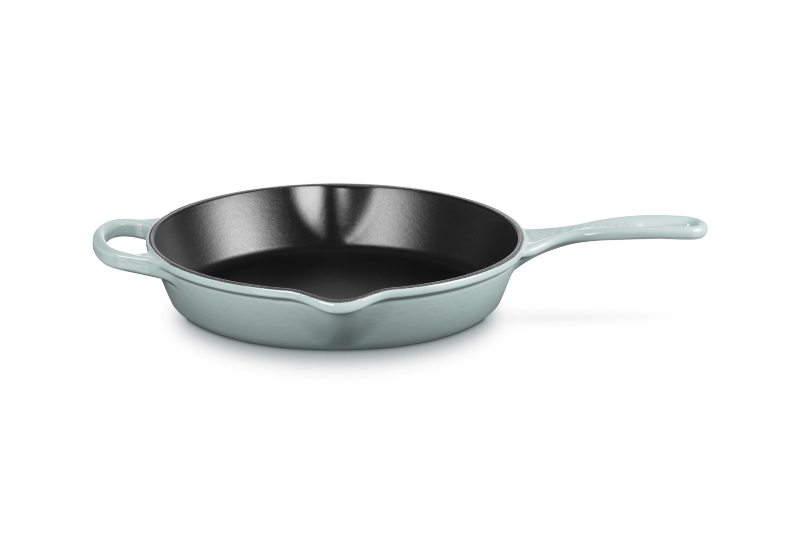Skillet with light blue handle and body on a white background