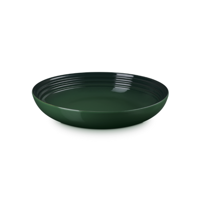 Green ceramic bowl on a white background