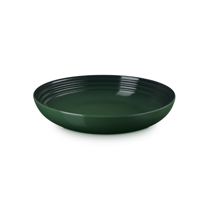 Green ceramic bowl on a white background