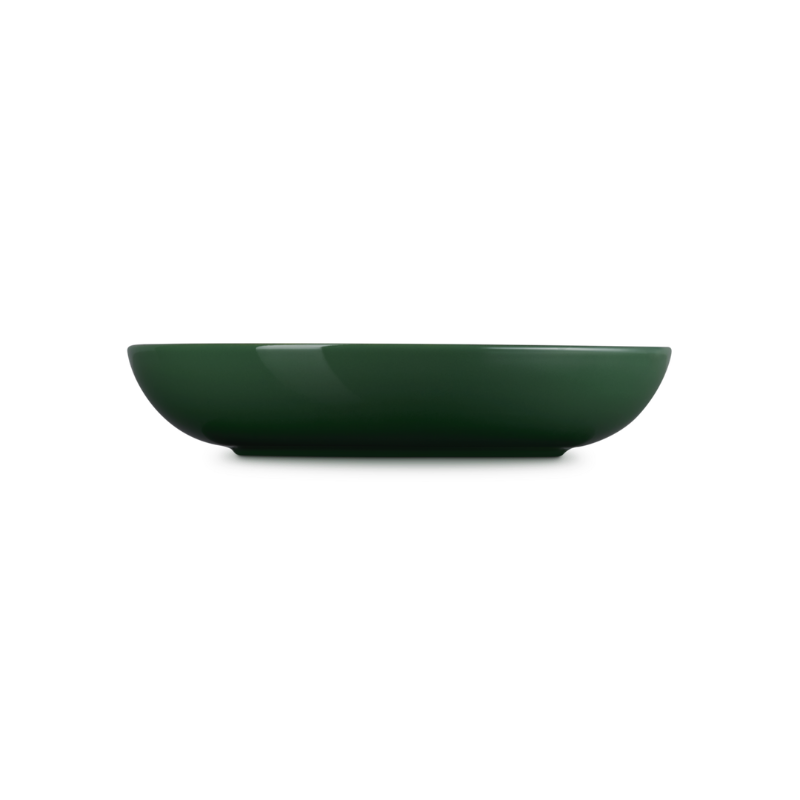 Green ceramic bowl on a white background