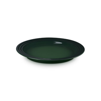 Green ceramic plate on a white background