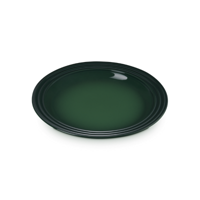 Green ceramic plate on a white background