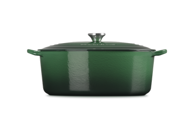 Green enameled cast iron casserole dish on a white background