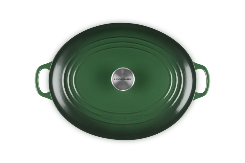Green oven dish with handles on a white background