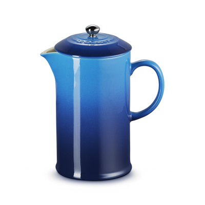 Blue French press coffee maker on a white background