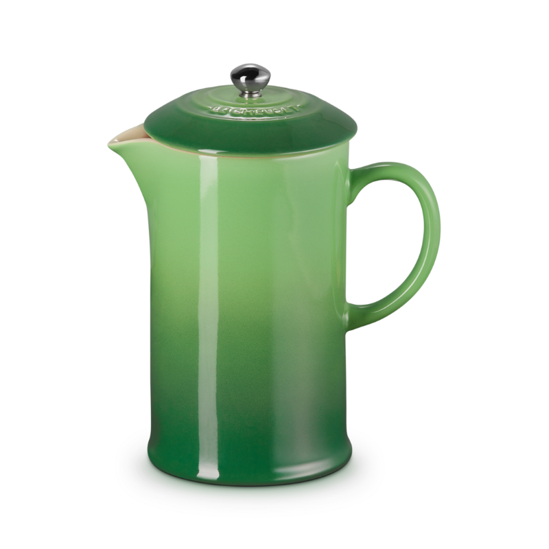 Green French press coffee maker on a white background