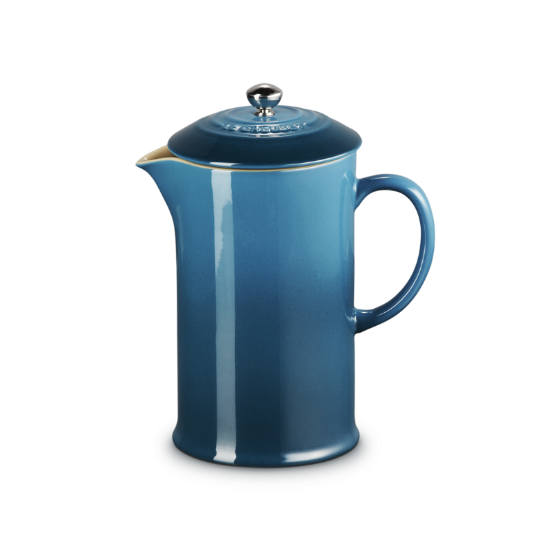 Blue French press coffee maker on a white background