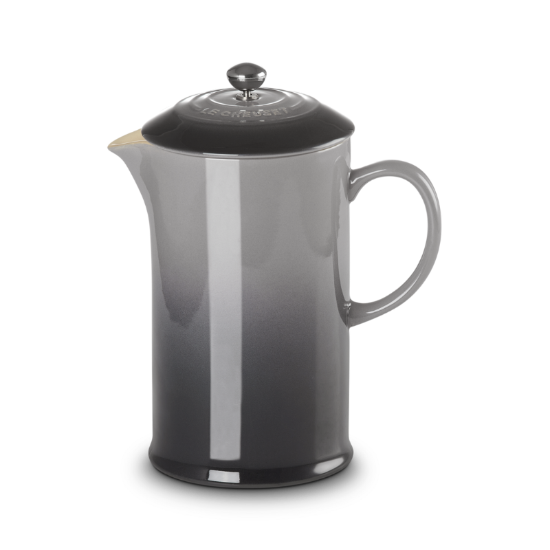Black French press coffee maker on a white background