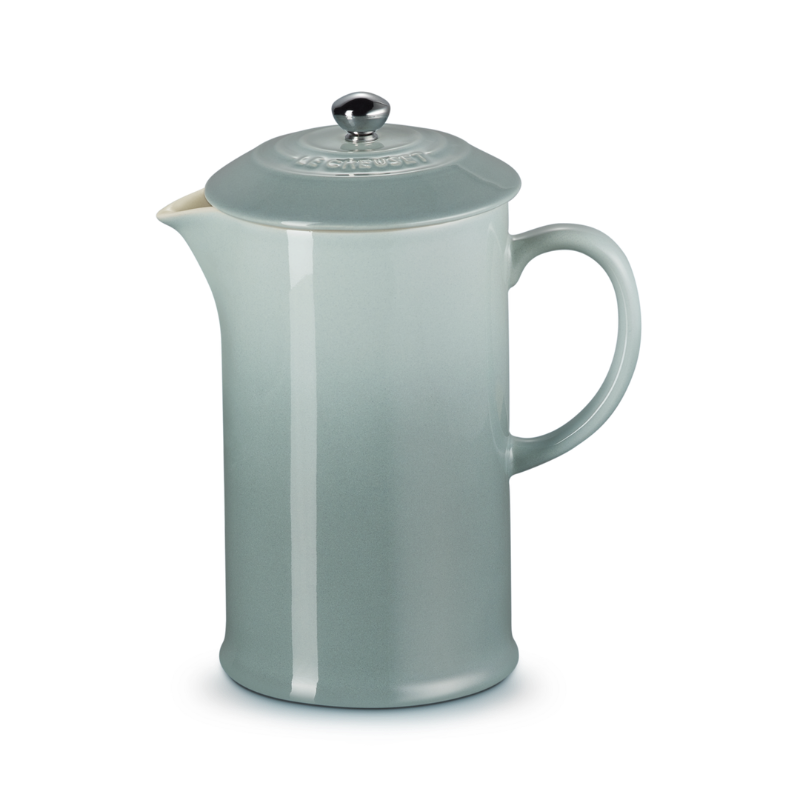 Gray ceramic pitcher with a lid on a white background