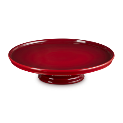 Red cake stand on a white background